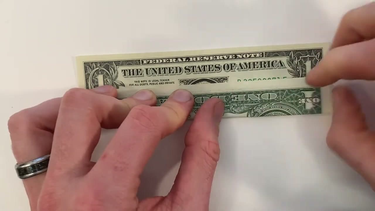 Step 2: Fold the Bottom Edge of the Bill Up a Third - How to Fold Money Into a Heart