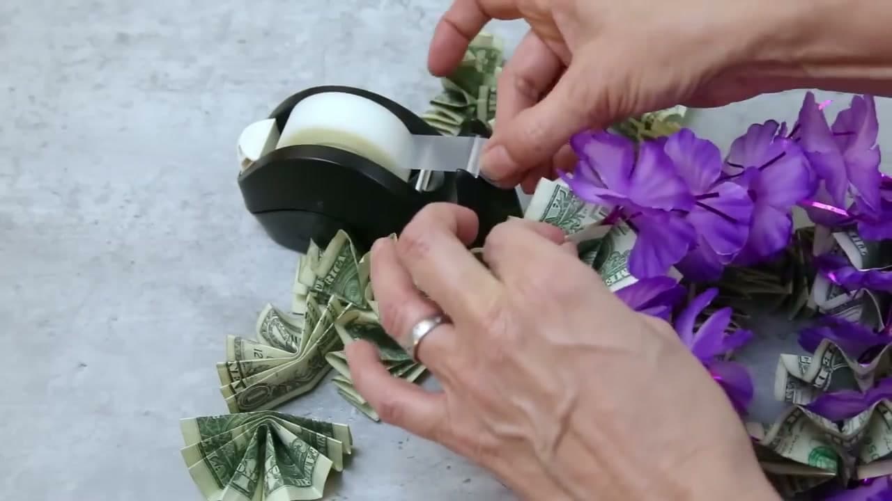 Step 4: Tape Each Folded Bill Onto a Lei Separator - How to Make a Money Lei: 2 Easy Methods for Graduation