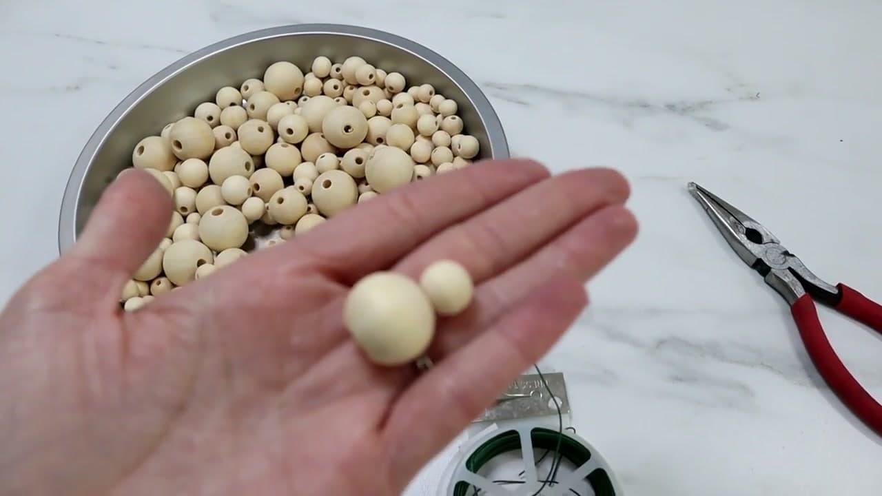 Step 2: Tip the Beads Into a Shallow Pan - How to Make Christmas Ornaments