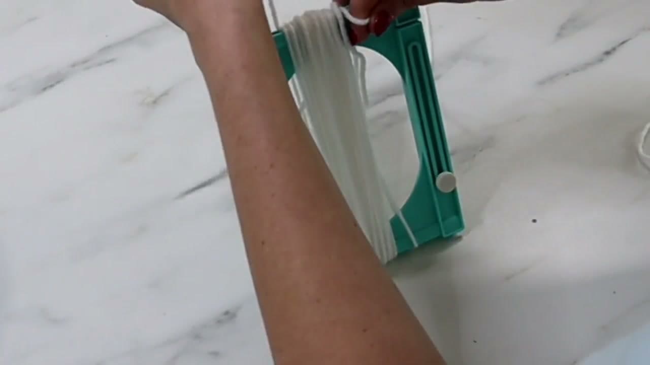 Step 6: Wrap Yarn Around a Tassel Maker - How to Make Christmas Ornaments