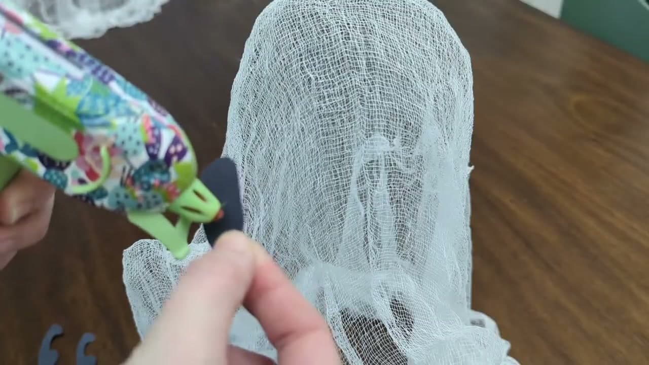 The finished result: How to Make a No-Sew Cheesecloth Ghost (Floating Halloween Decor)
