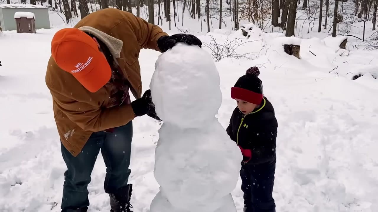 Step 5: Pack Snow Into the Seams Between the Snowballs - How to Make a Snowman