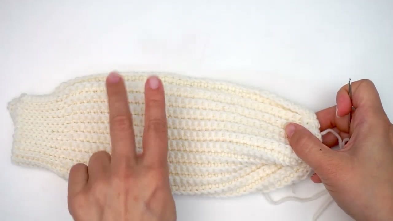 Step 8: Step 8: Sew the side seam, leaving a thumb gap