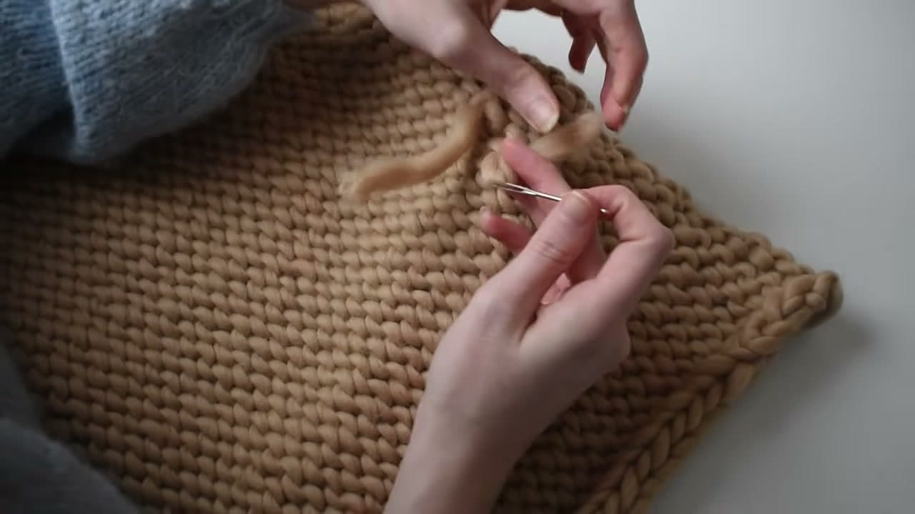 Step 7: Weave In the Loose Ends on the Sweater Panels - How to Knit a Chunky Sweater for Beginners