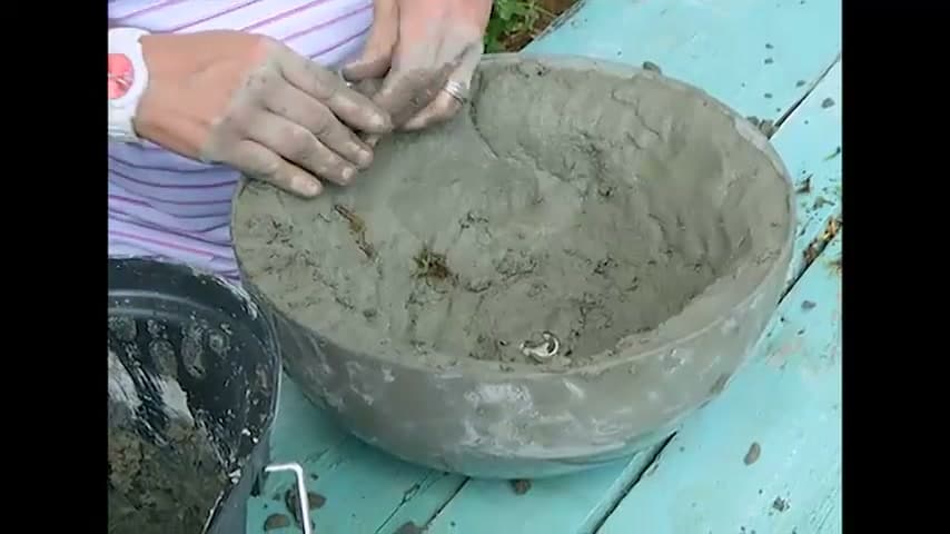 Step 4: Press Sphagnum Moss into the Outside - How to Make a Concrete Hanging Planter