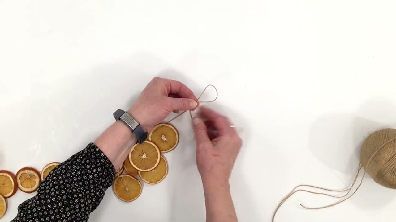 Step 8: Tie a Hanging Loop and Trim the Twine - How to Dry Orange Slices