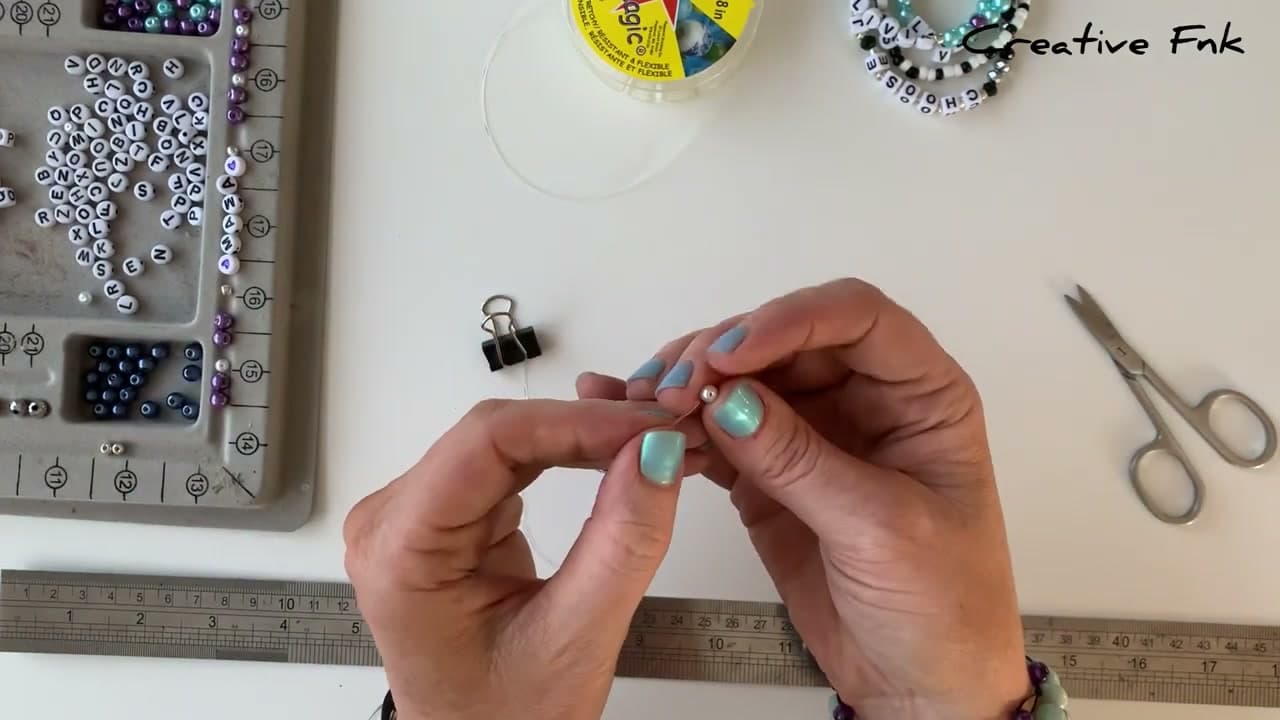 Step 5: Cut and pre-stretch the elastic - How to Make a Letter Bead Friendship Bracelet