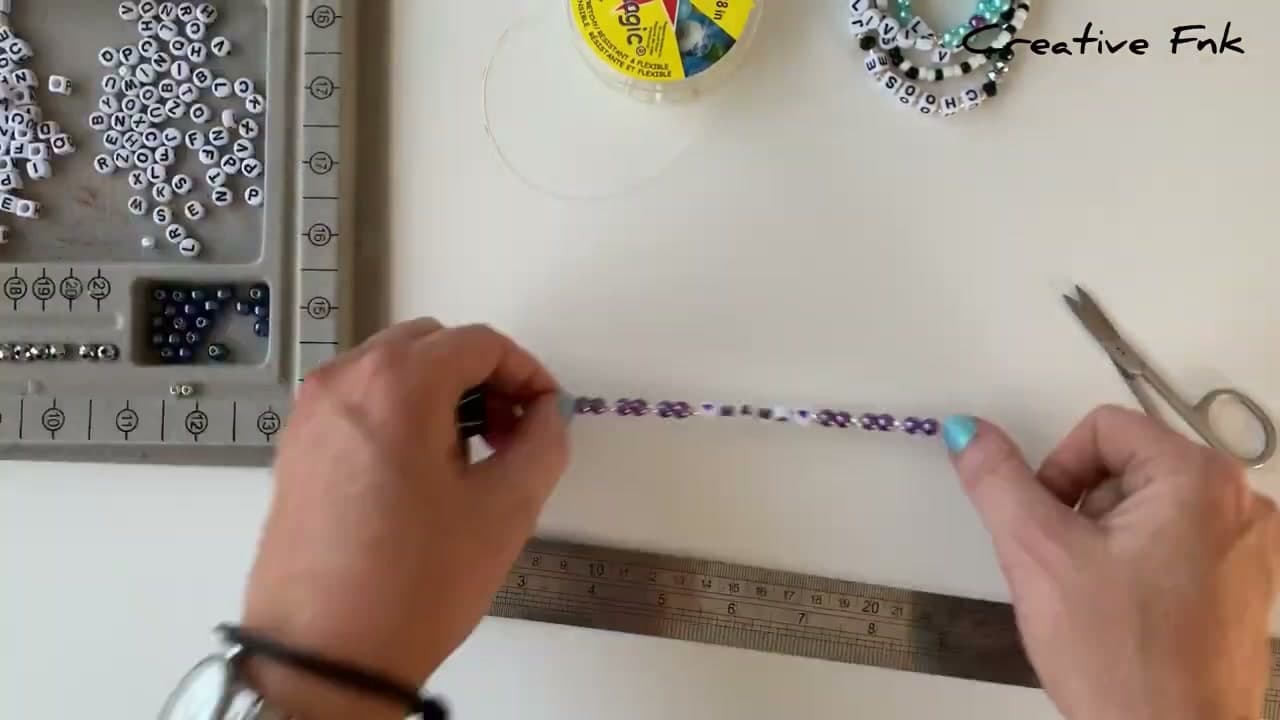 Step 6: Clip one end and thread the beads - How to Make a Letter Bead Friendship Bracelet