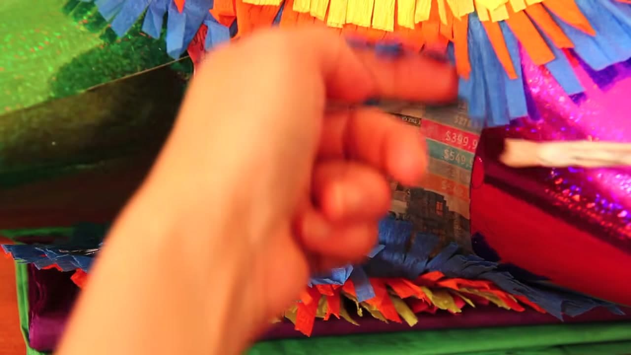 Step 9: Glue the Fringe in Rings - How to Make a Pinata
