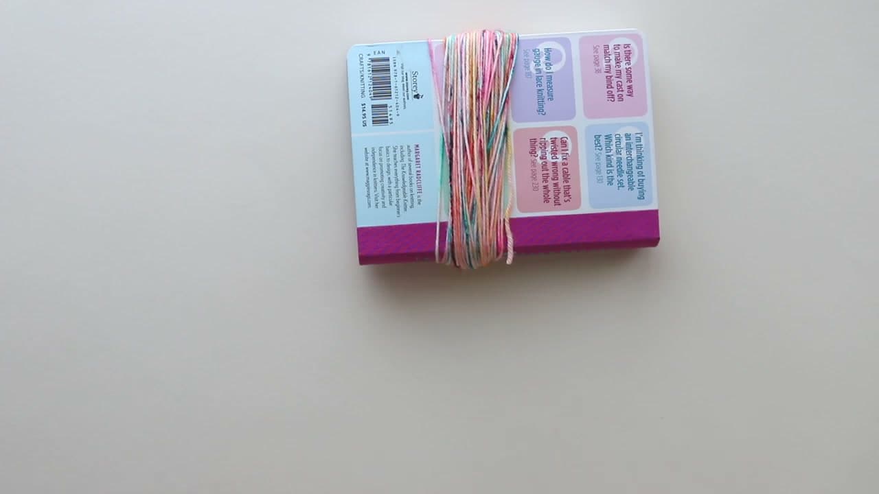 Step 1: Wrap the Yarn Around a Small Book - How to Make a Tassel and Attach It to Any Project
