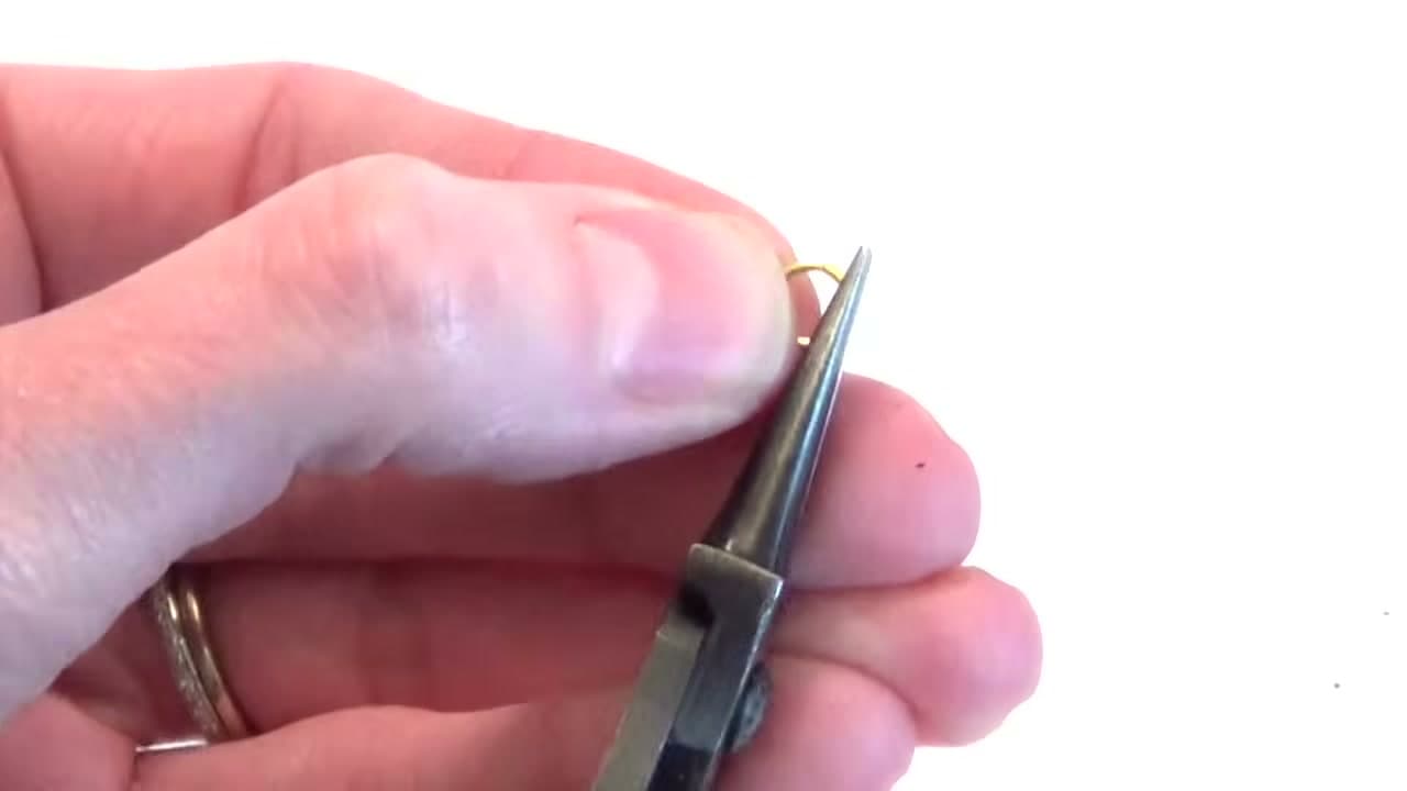 Step 2: Step 2: Grip the Ring With the Opening at the Top