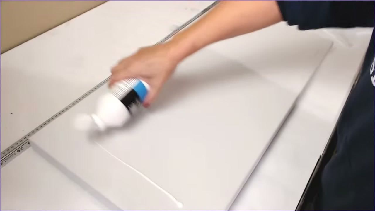 Step 2: Pour the Gesso Across the Canvas - How to Prime a Canvas with Gesso