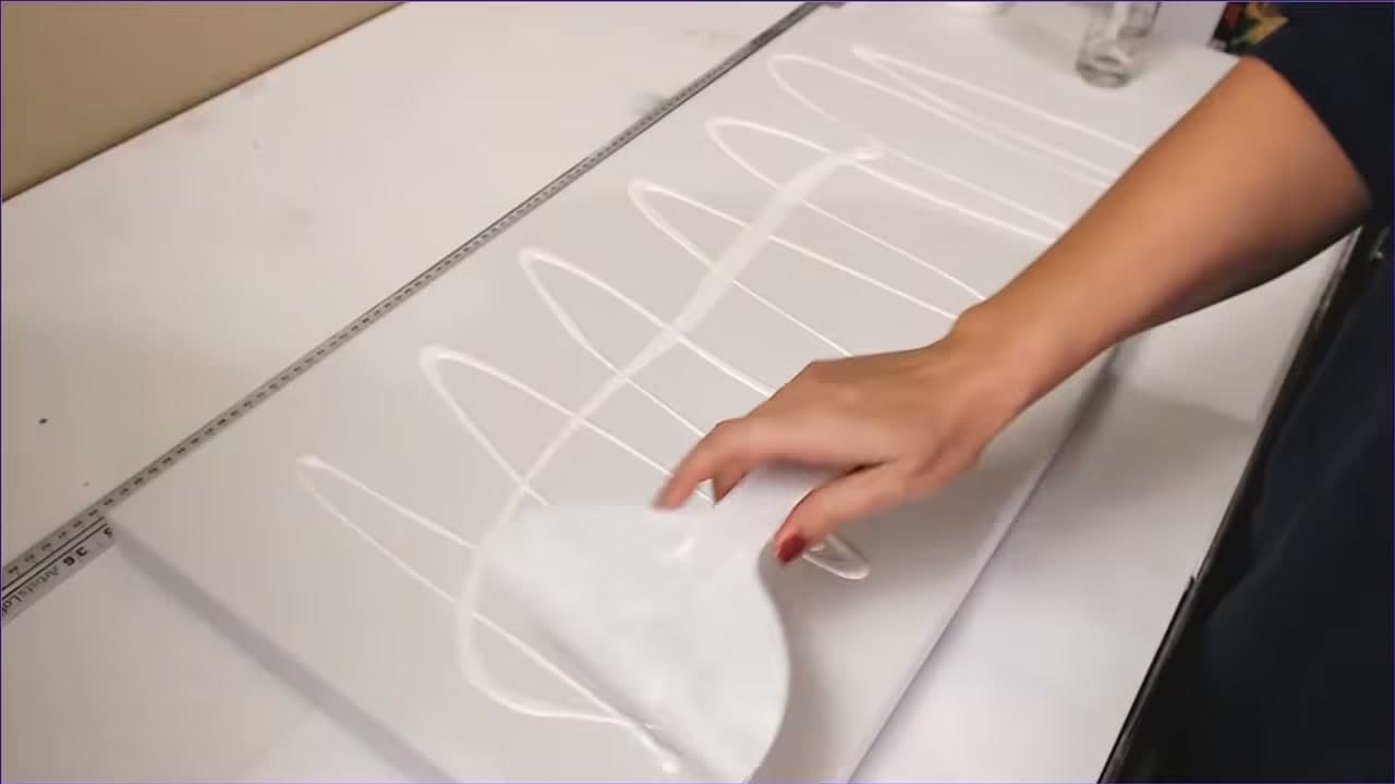 Step 3: Spread It with a Putty Knife - How to Prime a Canvas with Gesso