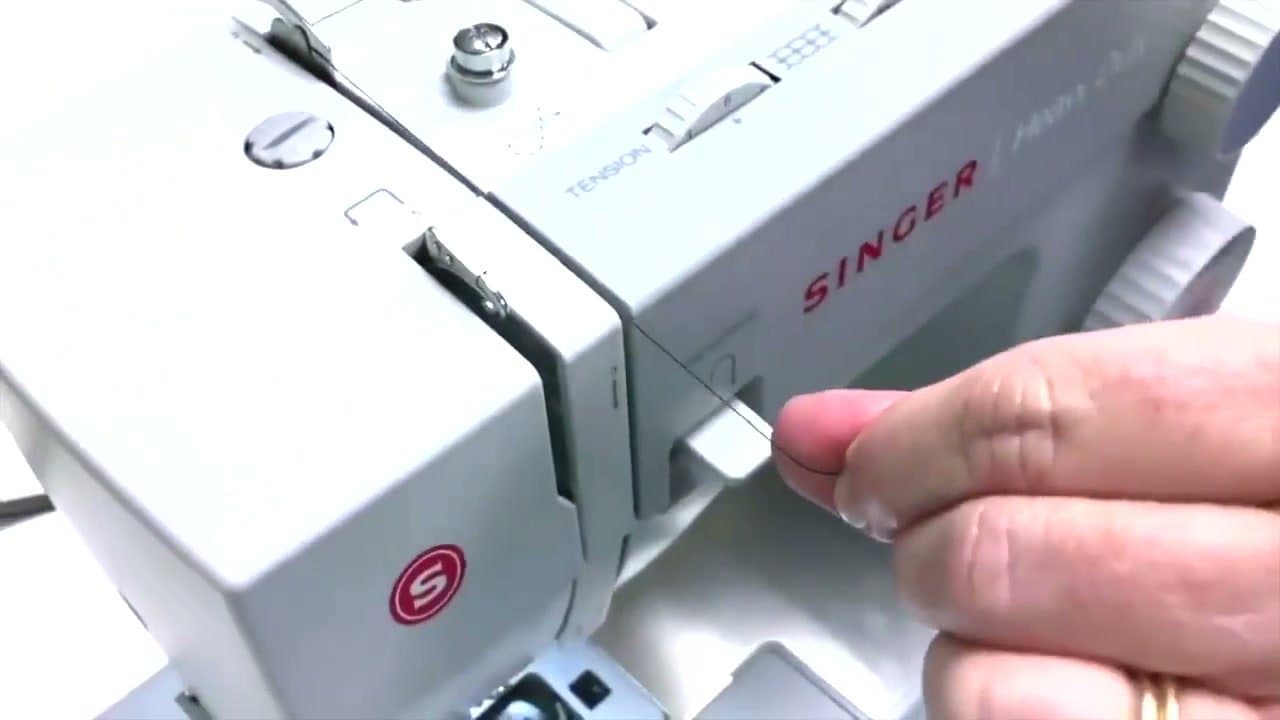 Step 2: Step 2: Run the thread through the upper guides