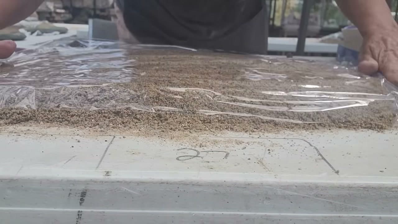 Step 4: Cover the Sand With Plastic Wrap - How to Make a Concrete Leaf Casting