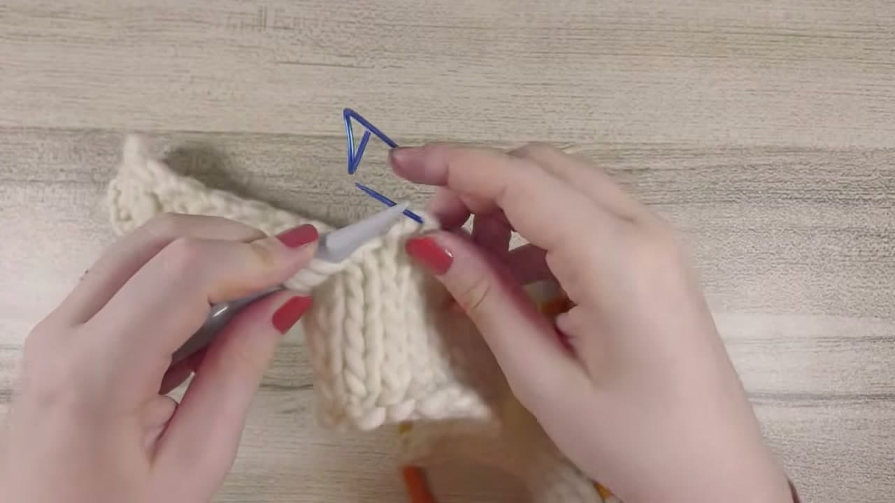 Step 6: Slide the Held Center Stitches Off the Holder Onto a Needle - How to Pick Up Stitches Knitting a Neckband