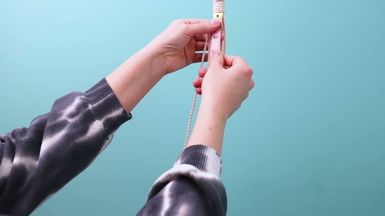 Step 4: Measure Down and Tie a Square Knot - How to Make a Macrame Plant Hanger: 7 Step DIY Tutorial