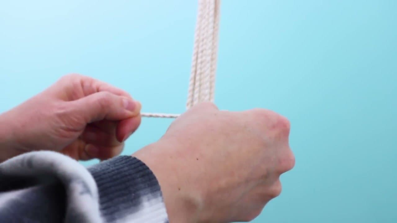 Step 5: Tie 4 Square Knots Around the Ring - How to Make a Macrame Plant Hanger: 7 Step DIY Tutorial