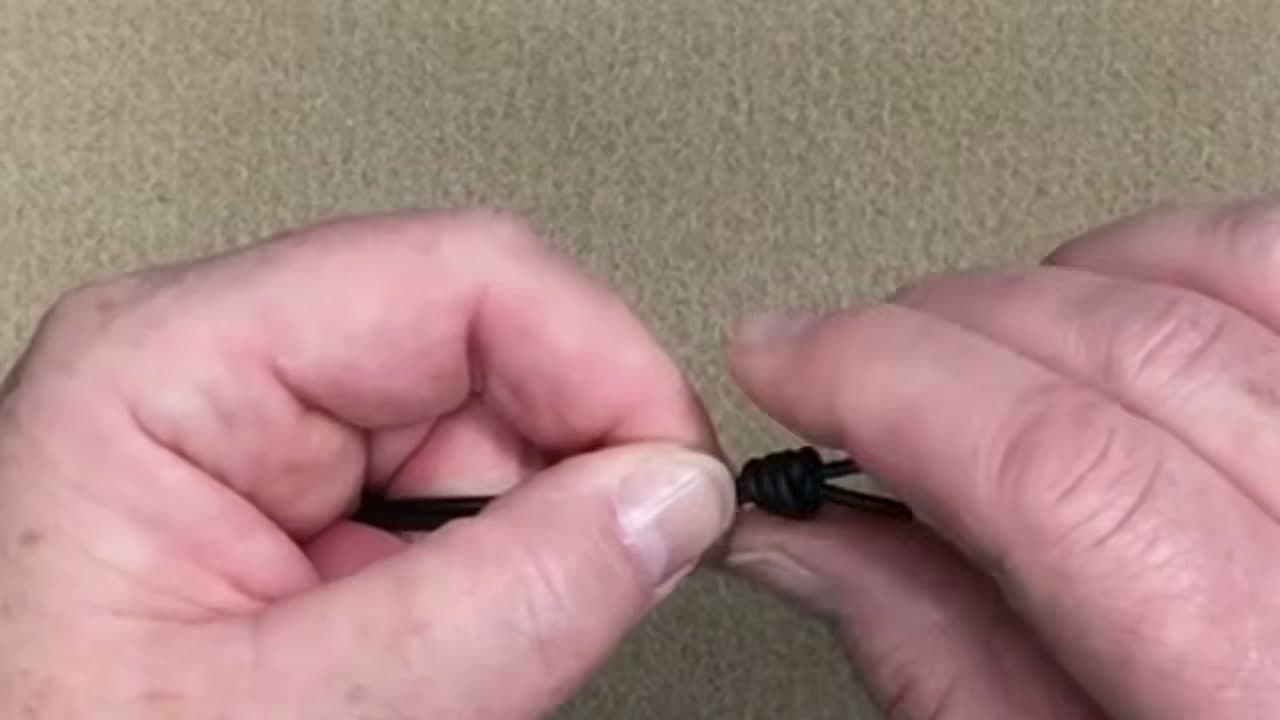 Step 5: Tighten the First Knot - How to Tie a Bracelet Knot (Adjustable Sliding Knot)