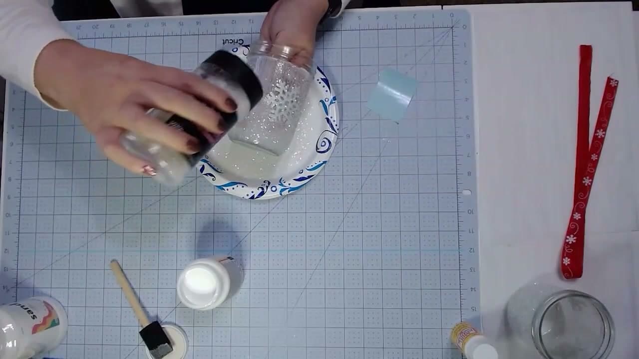 Step 5: Shake Extra-Fine Glitter Over the Wet Mod Podge - How to Make Mason Jar Luminaries