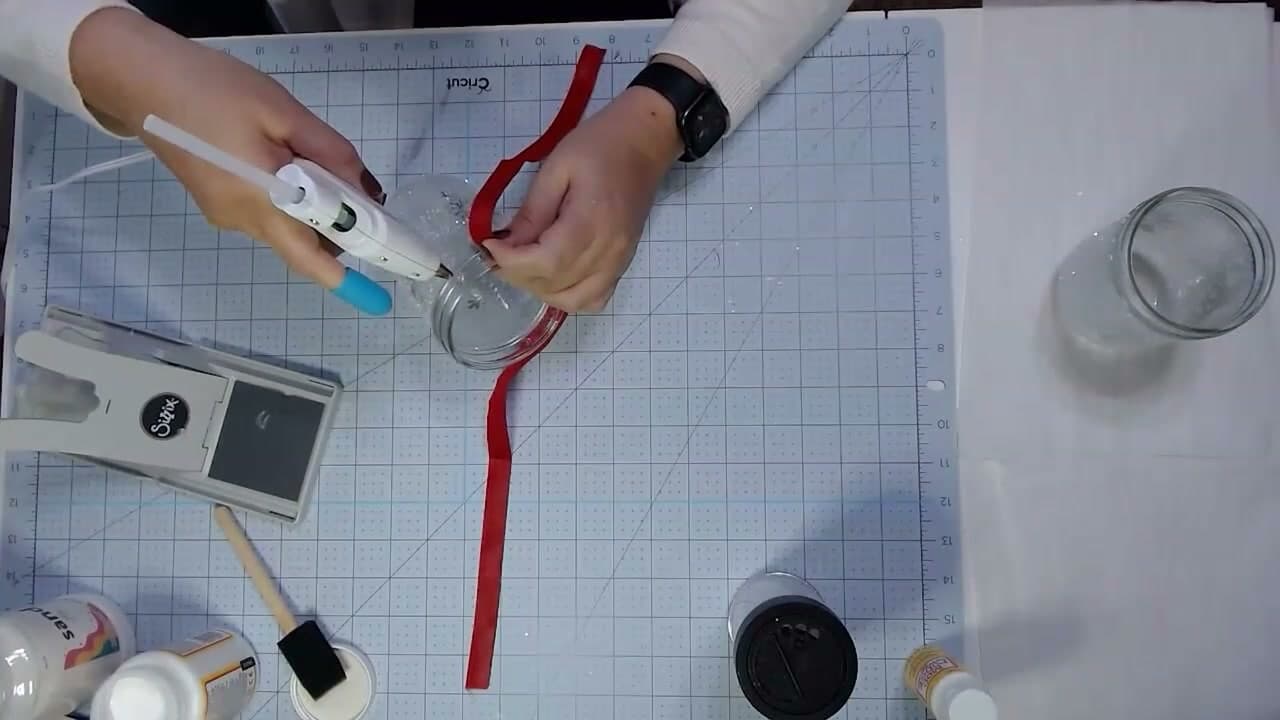Step 6: Hot-Glue the Ribbon Around the Jar Neck - How to Make Mason Jar Luminaries