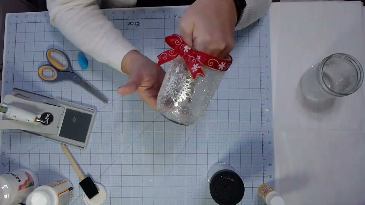 Step 7: Tie the Bow and Trim the Ribbon Tails - How to Make Mason Jar Luminaries