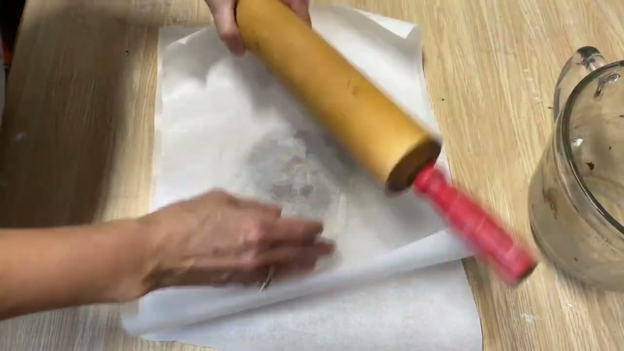 Step 4: Roll the Dough Between Two Sheets of Parchment Paper